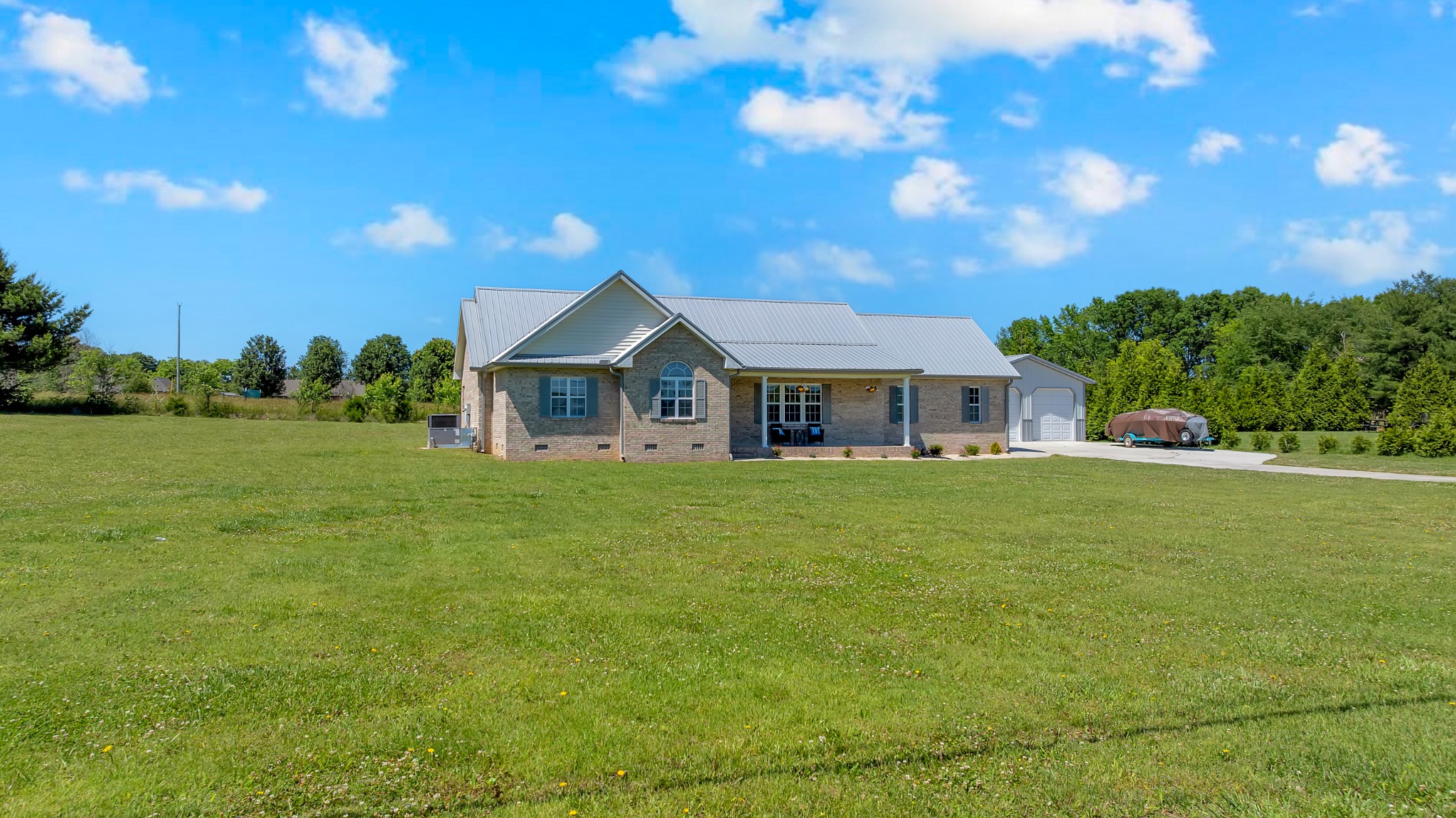 3896 Lynchburg Road Winchester, TN 37398 - Photo 1 of 57 a front view of a house with garden
