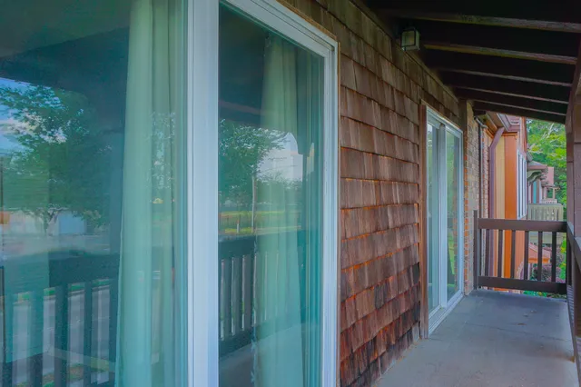 a view of entryway with a small yard