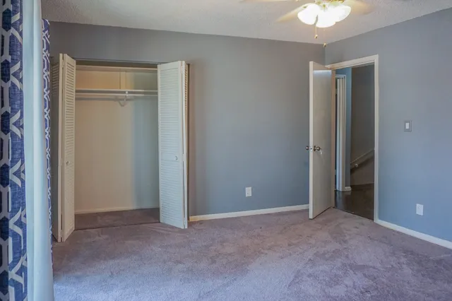 an empty room with closet area