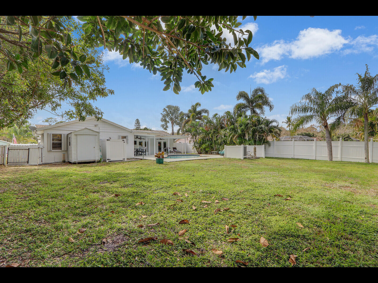 609 Oak Terrace Jupiter, FL 33458 - Photo 26 of 28 a view of a house with a yard