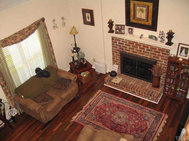 102 Nicholson Road Garner, NC 27529 - Photo 2 of 12 Stunning living room w/vaulted ceiling and cozy fireplace