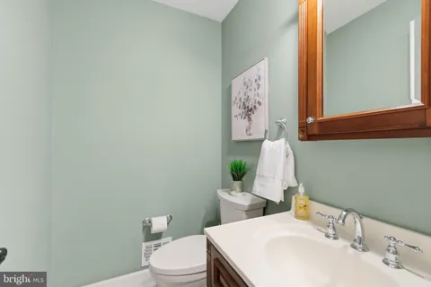 a bedroom with a bed and a mirror