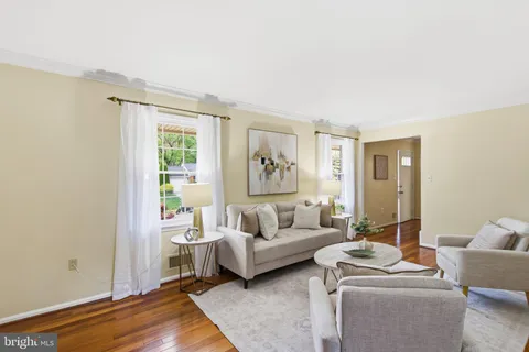 a view of a livingroom with furniture and wooden floor