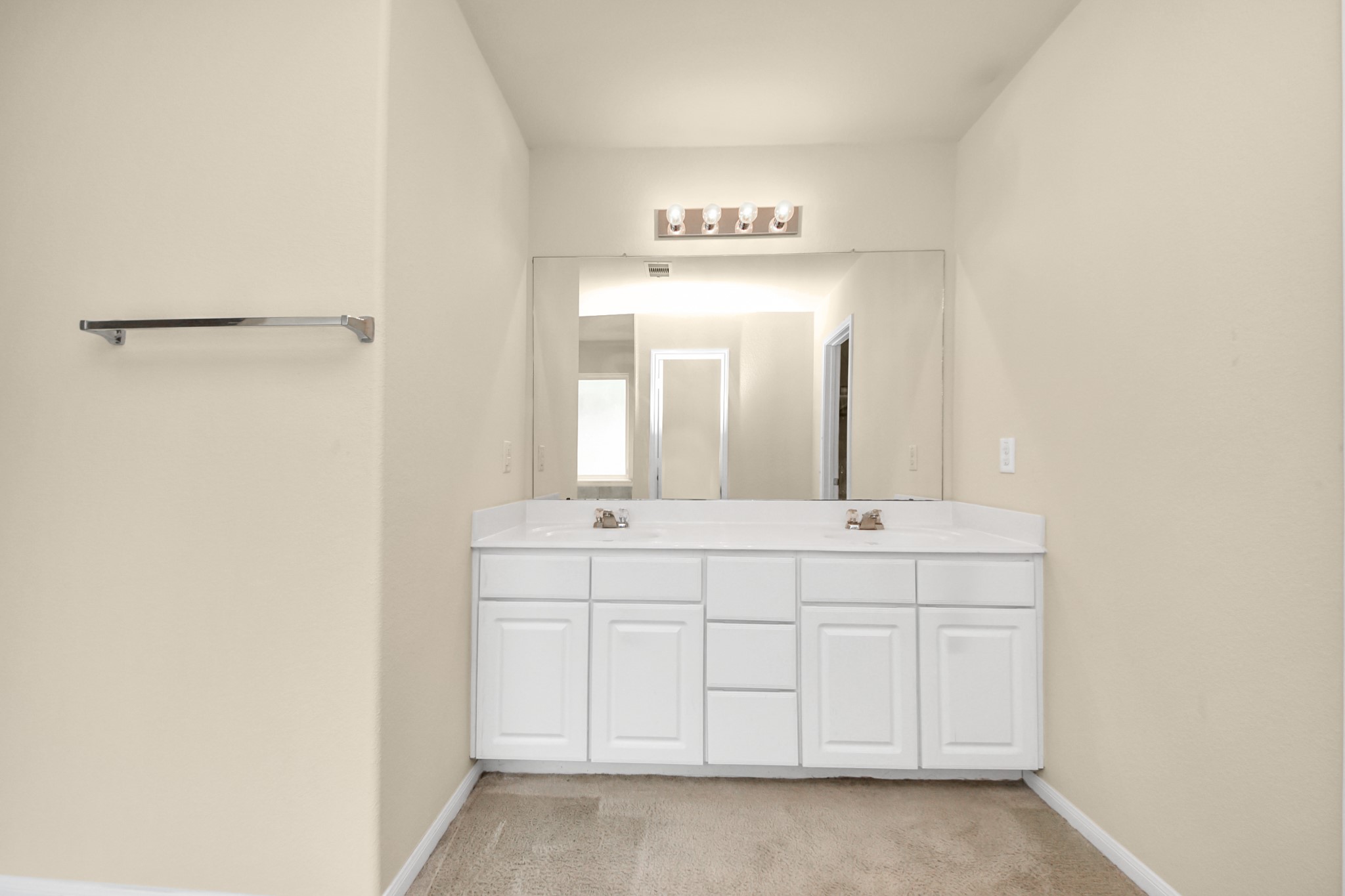 15623 Sheldon Ridge Way Houston, TX 77044 - Photo 15 of 36 a spacious bathroom with a double vanity sink and a mirror