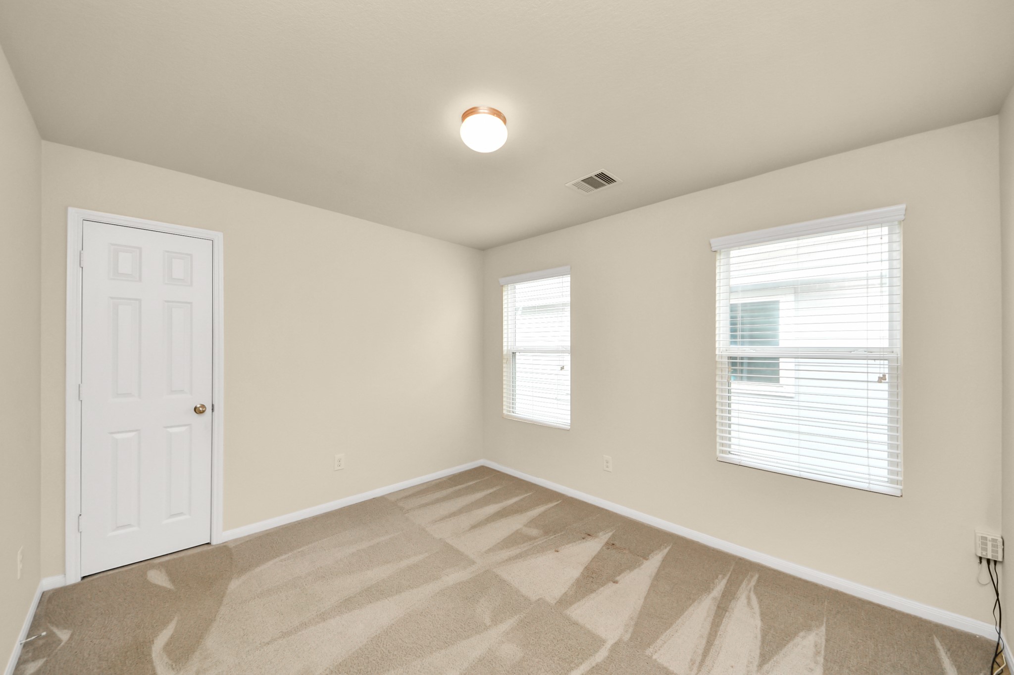 15623 Sheldon Ridge Way Houston, TX 77044 - Photo 23 of 36 a view of an empty room with a window