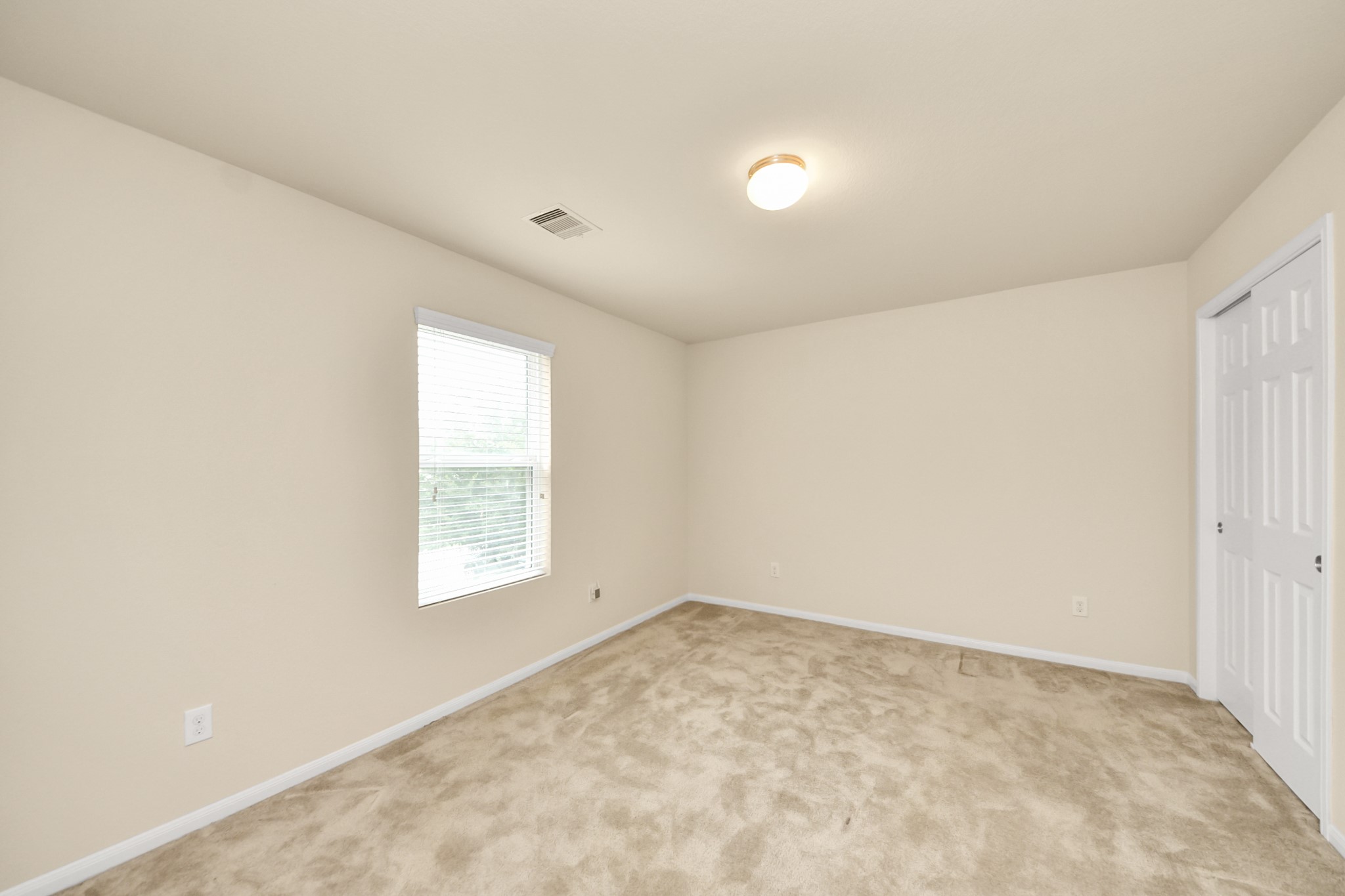 15623 Sheldon Ridge Way Houston, TX 77044 - Photo 25 of 36 an empty room with a window
