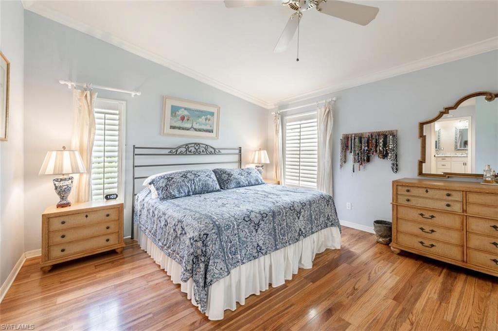 401 Countryside Drive Naples, FL 34104 - Photo 16 of 30 a bedroom with a bed and a dresser