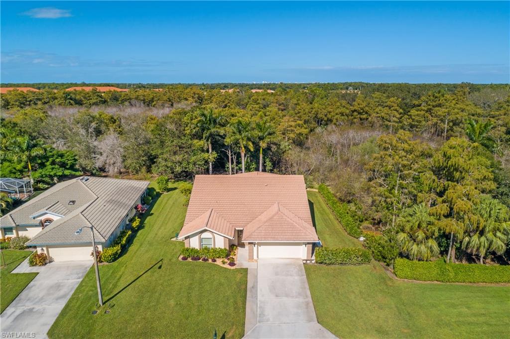 401 Countryside Drive Naples, FL 34104 - Photo 2 of 30 an aerial view of a house with a yard