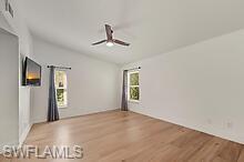 401 Countryside Drive Naples, FL 34104 - Photo 22 of 30 a view of empty room with windows