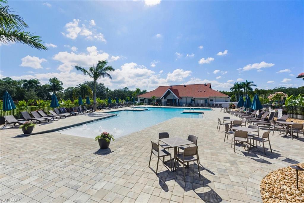 401 Countryside Drive Naples, FL 34104 - Photo 26 of 30 a view of a swimming pool and outdoor space