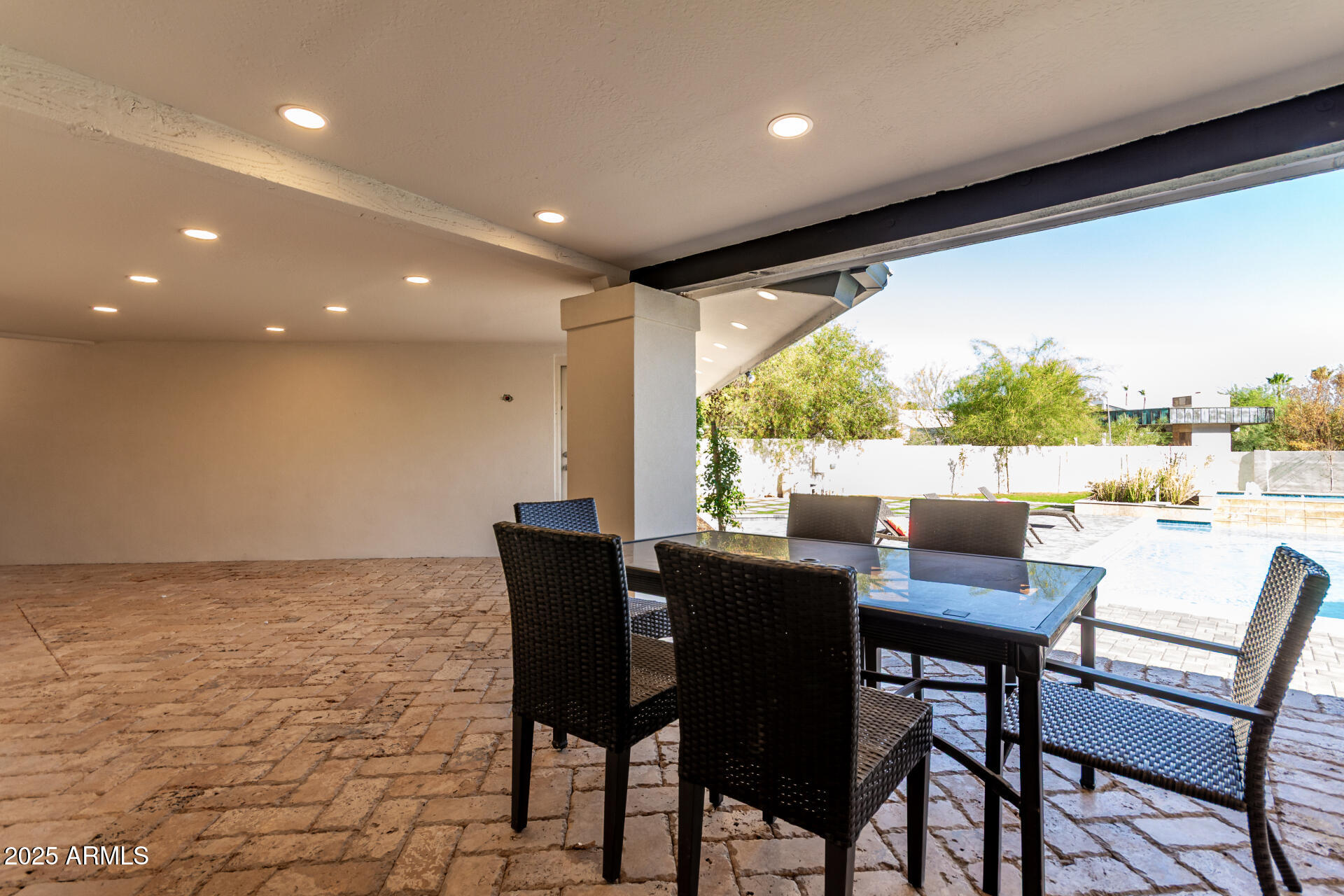 3301 East Rovey Avenue Paradise Valley, AZ 85253 - Photo 103 of 105 a dining room with furniture and a floor to ceiling window