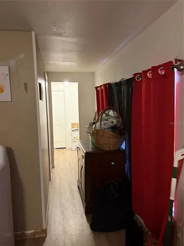 a living room with furniture and a closet