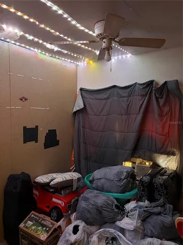 a bedroom with furniture and a chandelier
