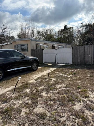 a view of a car in front of a house
