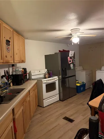 a kitchen with cabinets and a stove