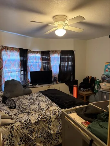 a kitchen with a stove and a chandelier