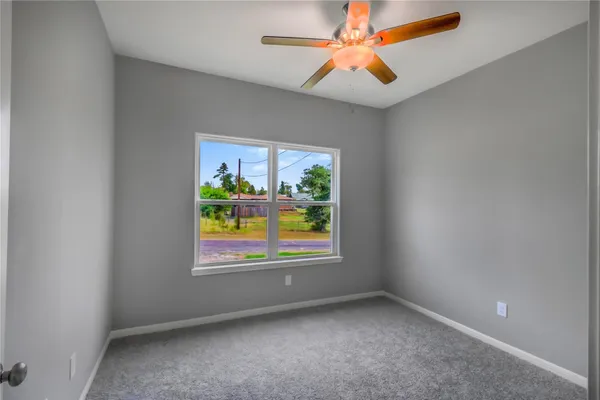 an empty room with closet area