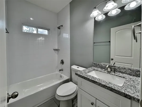 wooden floor with a bedroom and windows