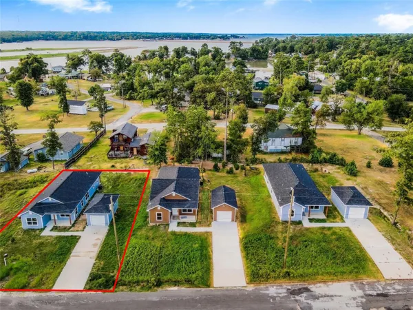 an aerial view of residential houses with outdoor space