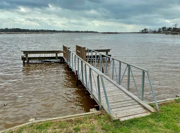 a view of a terrace with wooden floor and lake view