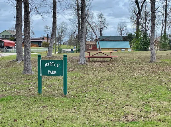 a sign board on the side of a road