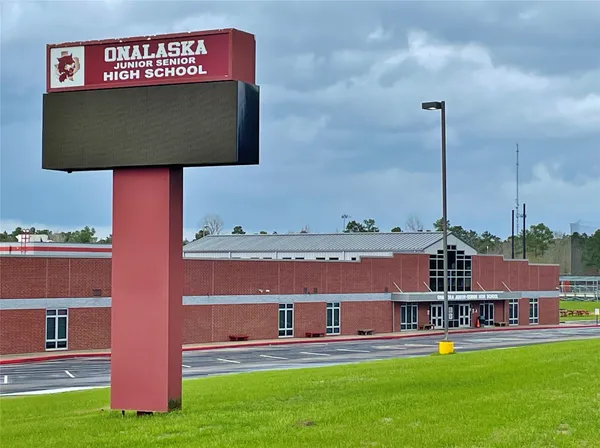 a view of a city with tall buildings and a big yard
