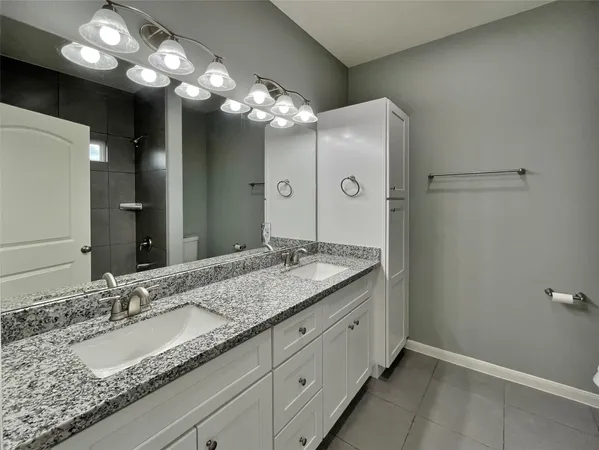 a bathroom with a bathtub a toilet and a shower