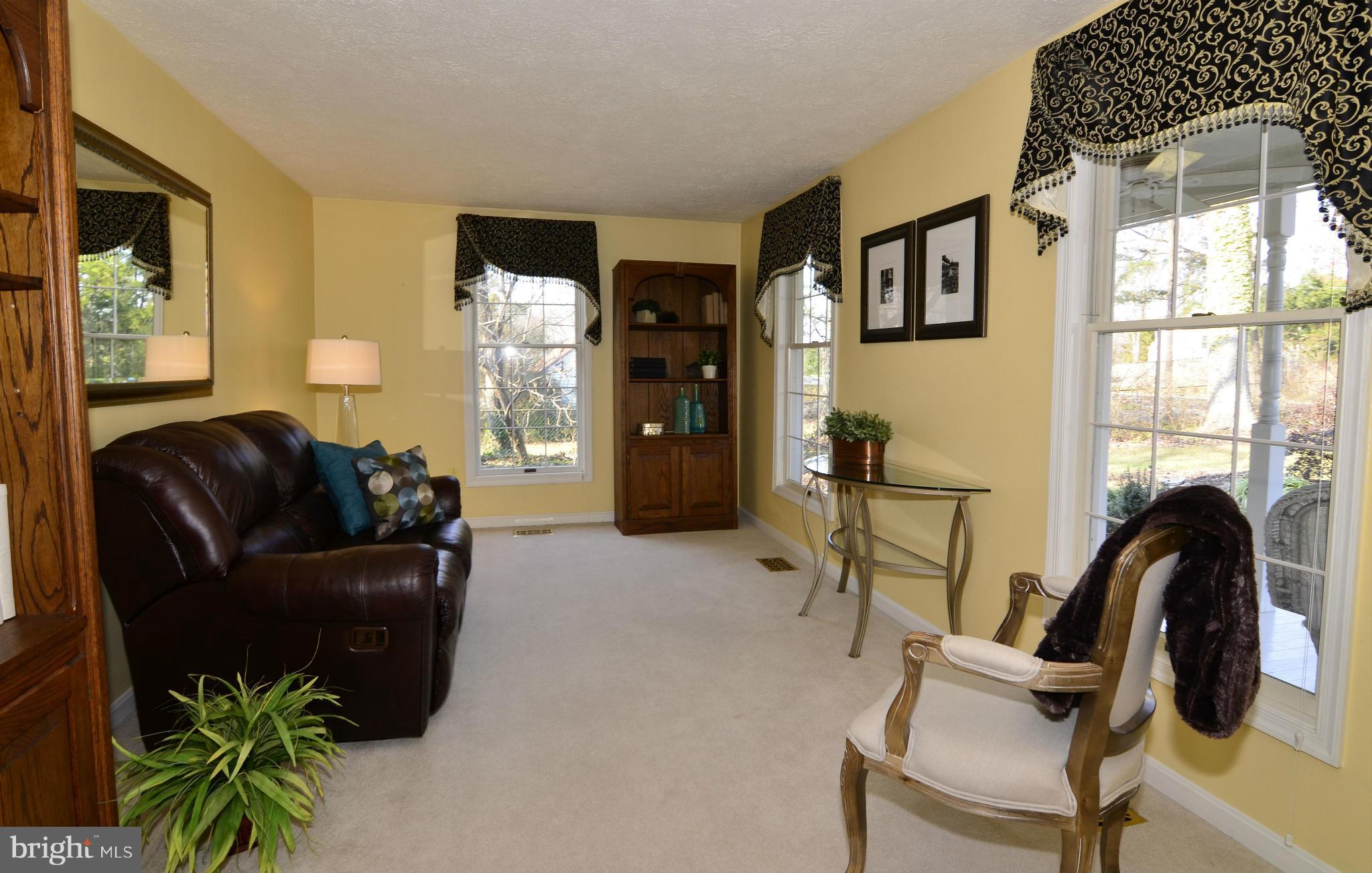 8725 Pohick Road Springfield, VA 22153 - Photo 5 of 22 The living room overlooks the covered front porch.
