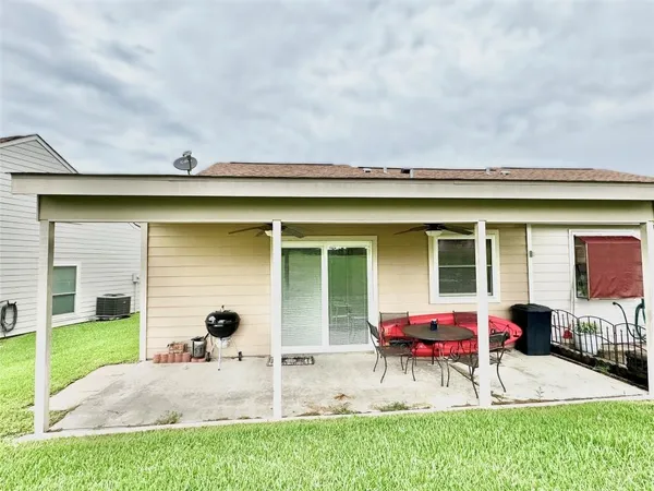 a view of house with outdoor seating space
