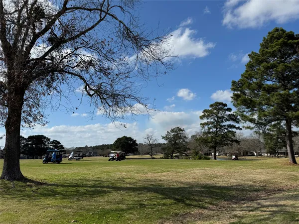 a view of a golf course with a big yard