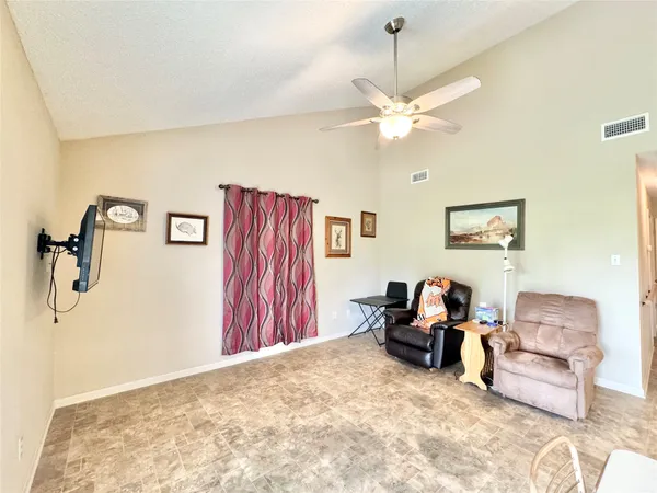 a bedroom with furniture and a chandelier