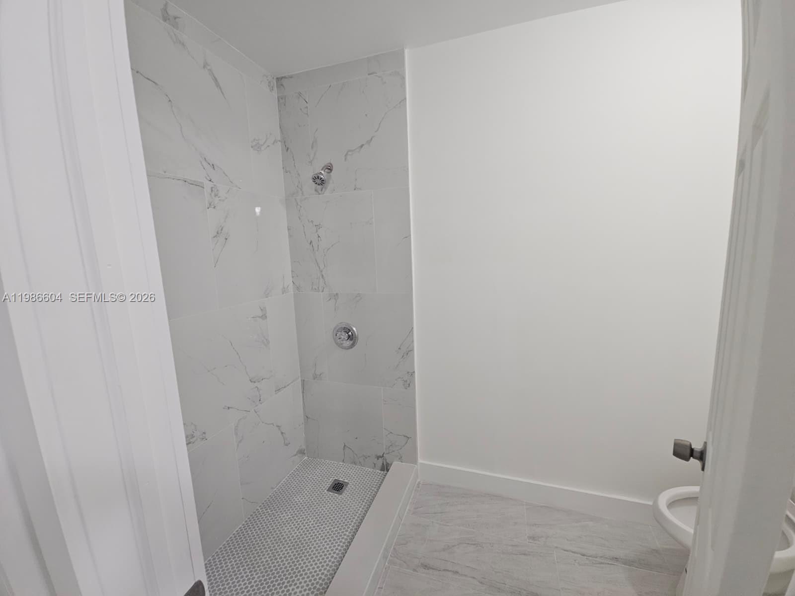 11287 Southwest 169th Street, Unit V41032 Miami, FL 33157 - Photo 13 of 14 a bathroom with a sink and shower
