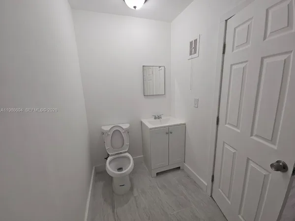 a bathroom with a sink and toilet