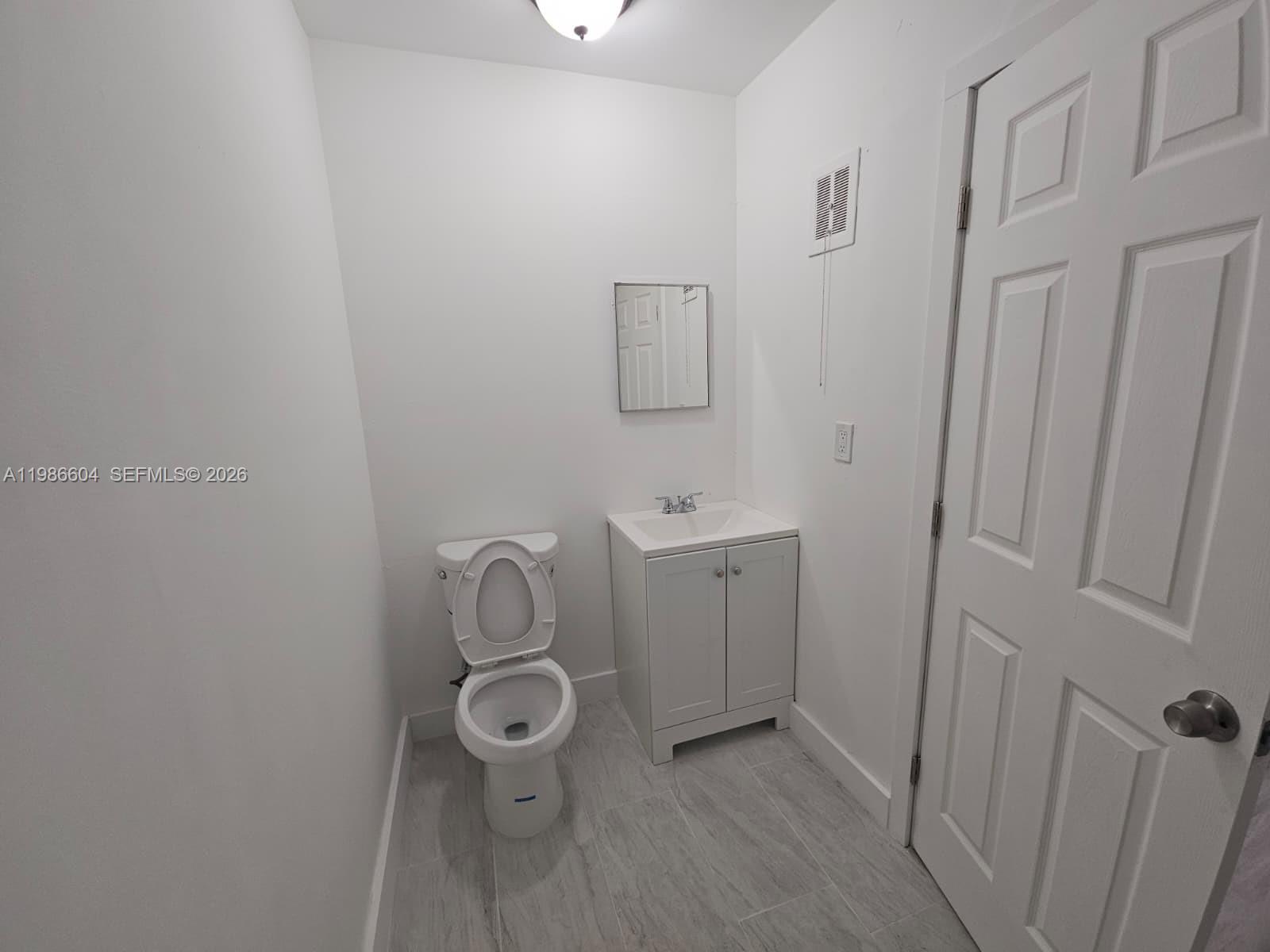 11287 Southwest 169th Street, Unit V41032 Miami, FL 33157 - Photo 14 of 14 a bathroom with a sink and toilet