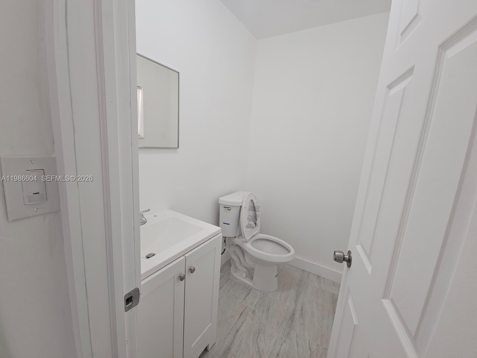 11287 Southwest 169th Street, Unit V41032 Miami, FL 33157 - Photo 3 of 14 a bathroom with a sink and toilet