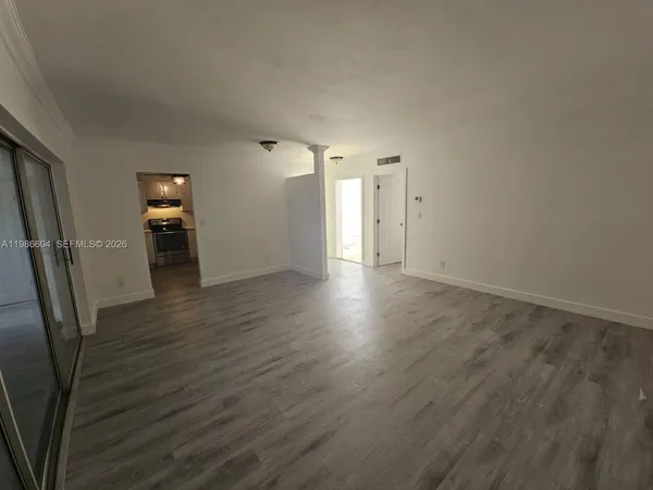 a view of a livingroom with wooden floor