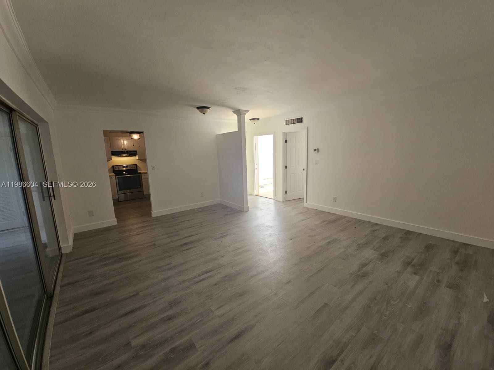 11287 Southwest 169th Street, Unit V41032 Miami, FL 33157 - Photo 5 of 14 a view of a livingroom with wooden floor