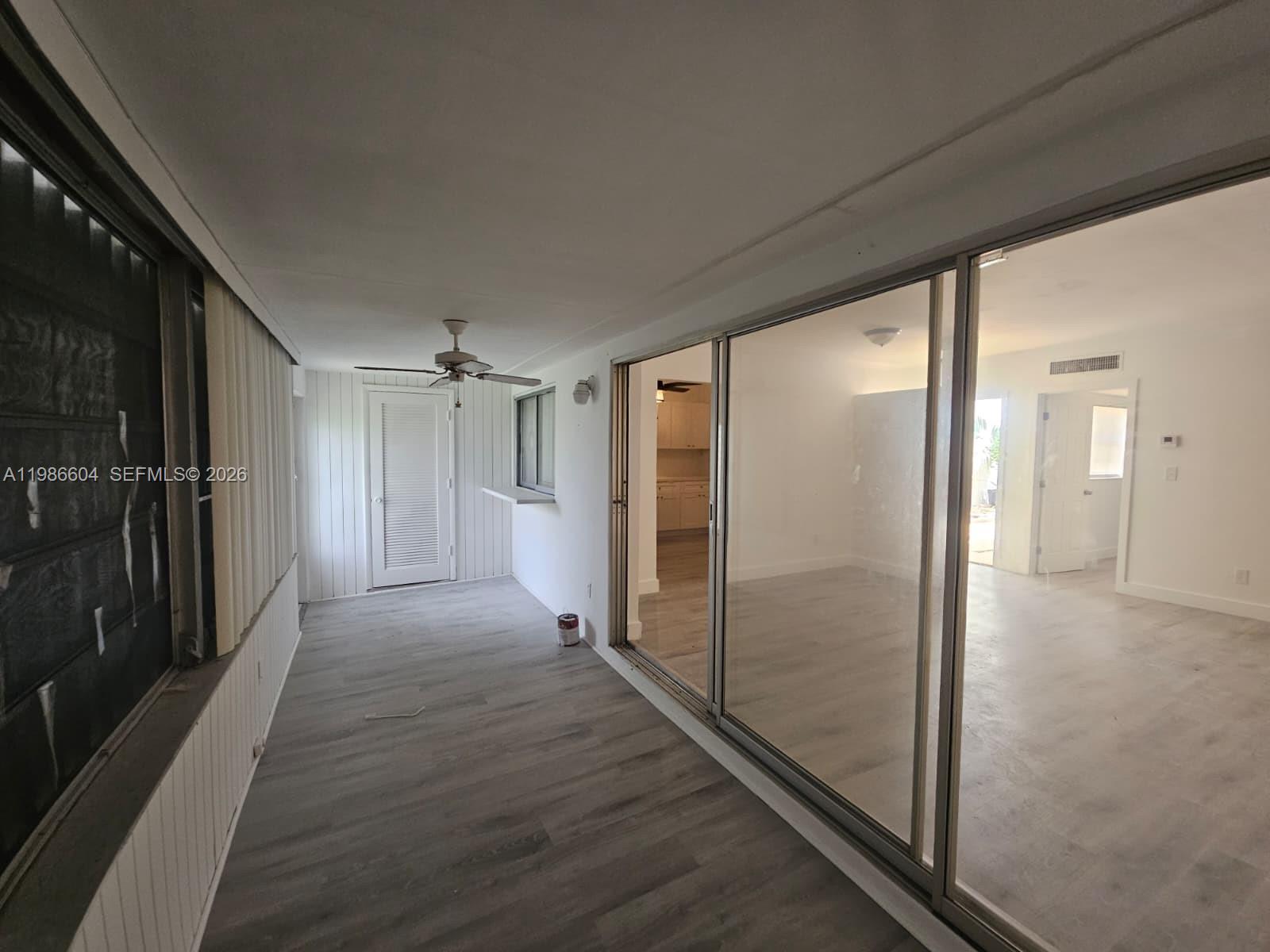 11287 Southwest 169th Street, Unit V41032 Miami, FL 33157 - Photo 8 of 14 a view of empty room with wooden floor
