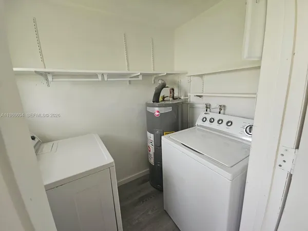 a utility room with dryer and washer