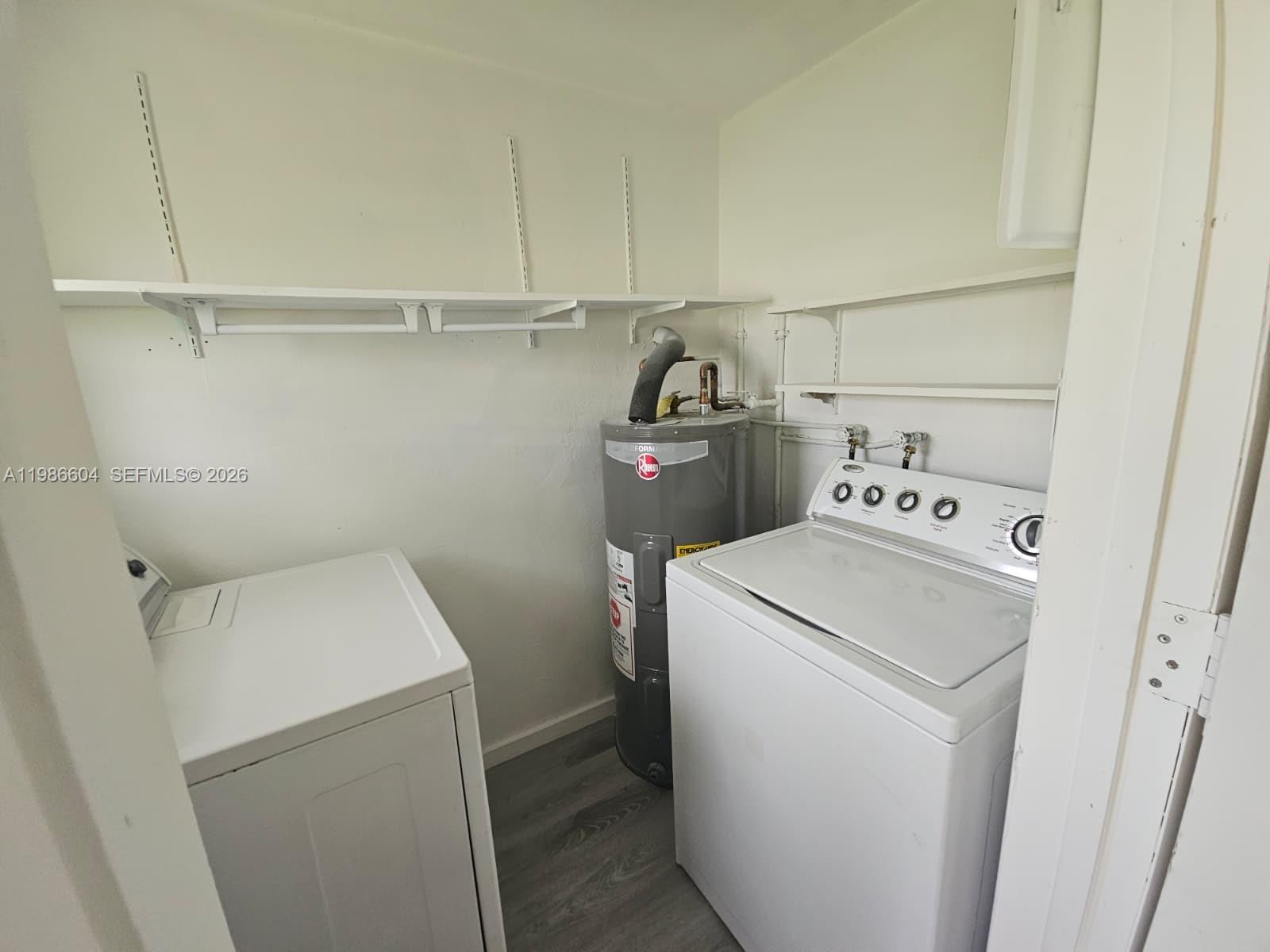 11287 Southwest 169th Street, Unit V41032 Miami, FL 33157 - Photo 9 of 14 a utility room with dryer and washer