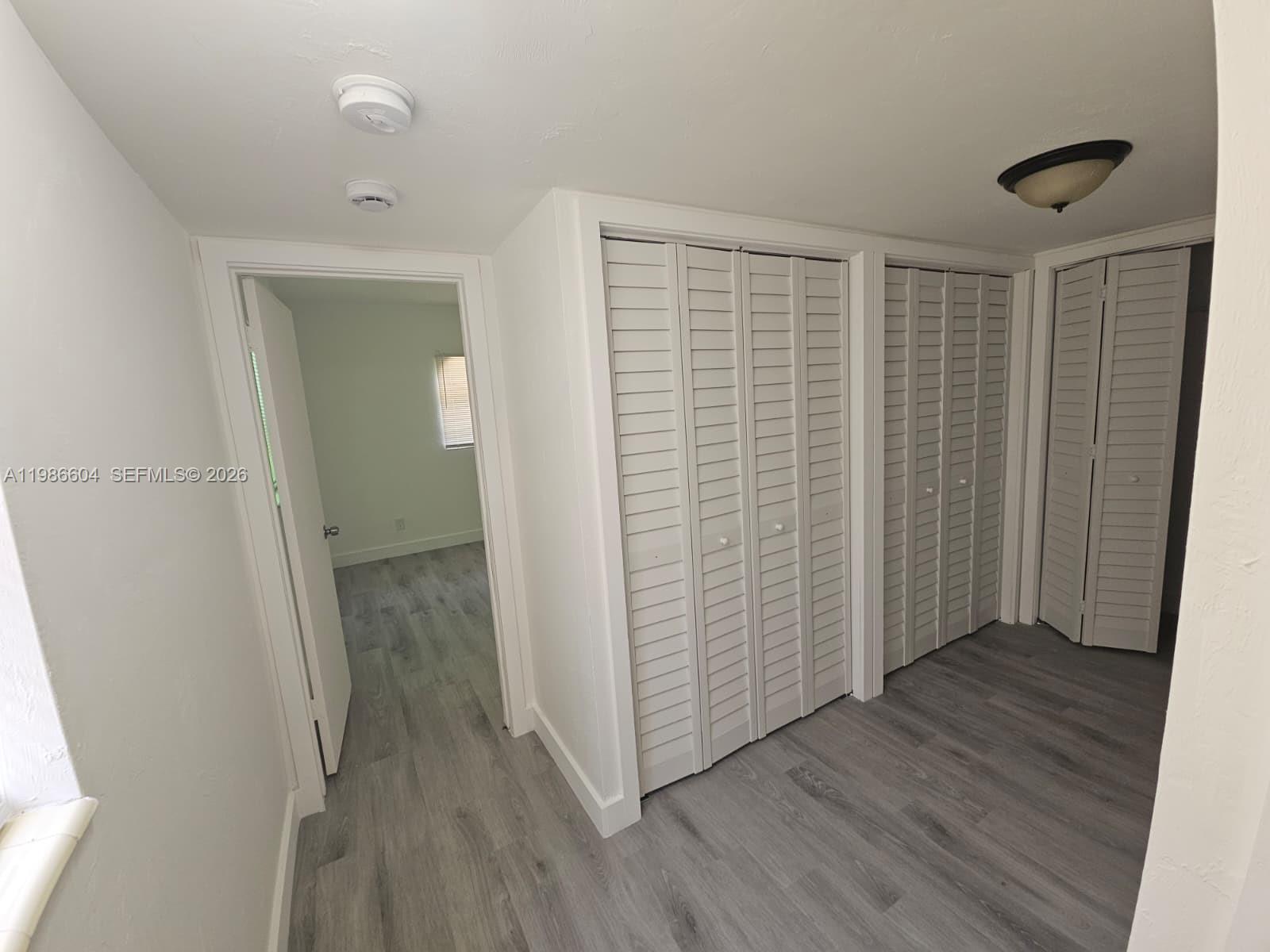 11287 Southwest 169th Street, Unit V41032 Miami, FL 33157 - Photo 10 of 14 wooden floor in a gallery