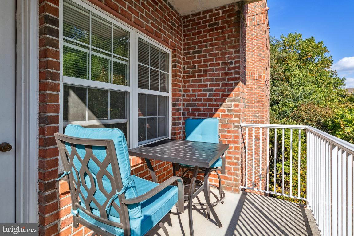 9510 Coyle Road, Unit 409 Owings Mills, MD 21117 - Photo 22 of 24 Balcony-table & chairs included