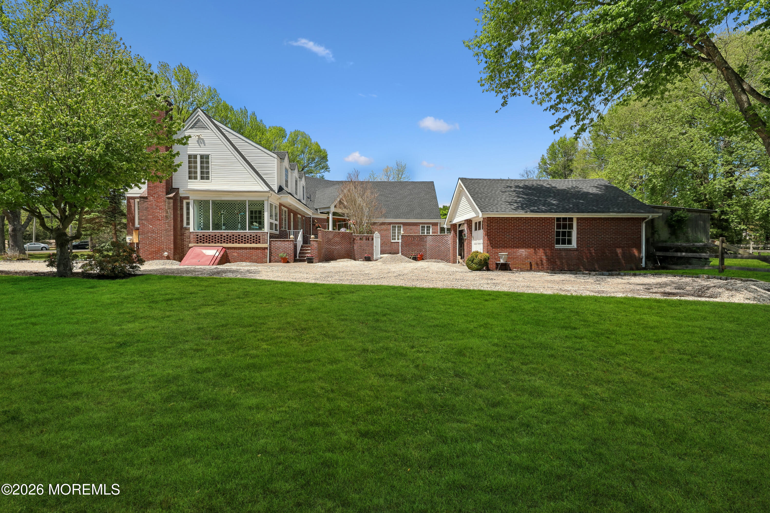 187 Hockhockson Road Colts Neck, NJ 07722 - Photo 2 of 55 a front view of house with yard and green space