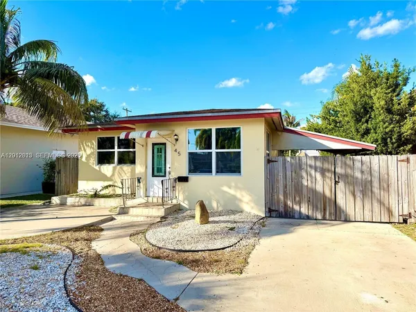 a house view with a backyard space