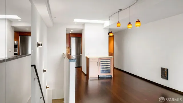 a view of an entryway with wooden floor