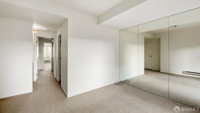 a view of a room with a hallway
