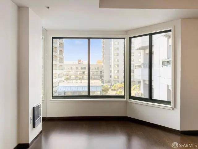 a view of room with window and a city view