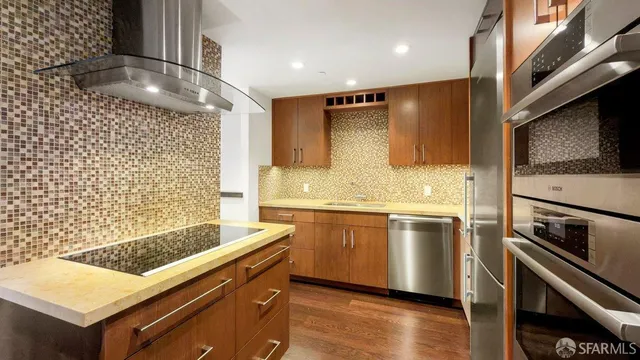 a bathroom with a sink a large mirror and a shower
