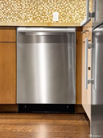 a view of wooden floor with a window
