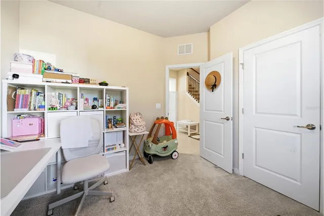 a room with furniture and musical instruments